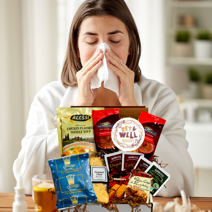 sick woman with get well soon gift box filled with soup cookies hot chocolate cookies tea biscotti 
